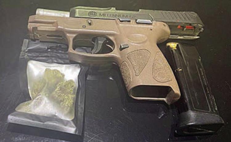 SPD officers found the marijuana and handgun shown above after a traffic stop early Friday morning.
