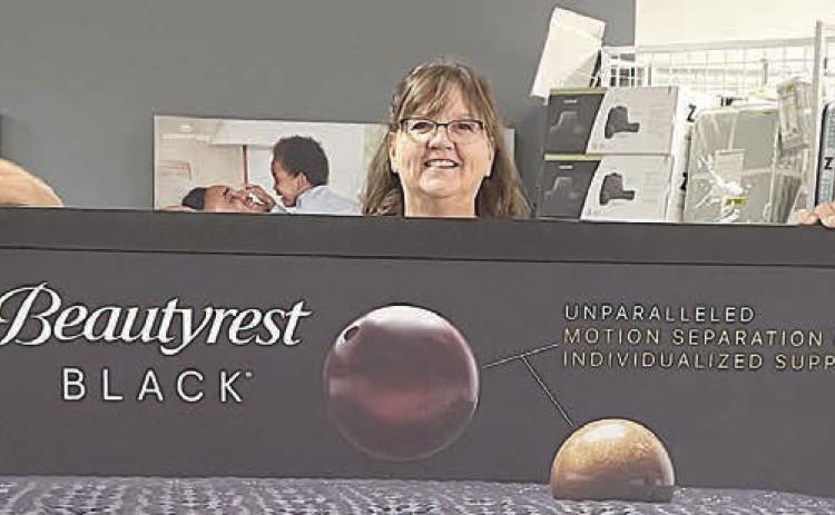 From albums, cassettes, and audio/video equipment in the early days to a full line of household appliances and bedding, along with many other services, Audio-Video Plus has evolved and expanded over the years. Shown above are (from left) Service Manager Jason Burkes and owners JoAnn and Bruce Lebeda. Sticker Photo By Darrell Vyvjala