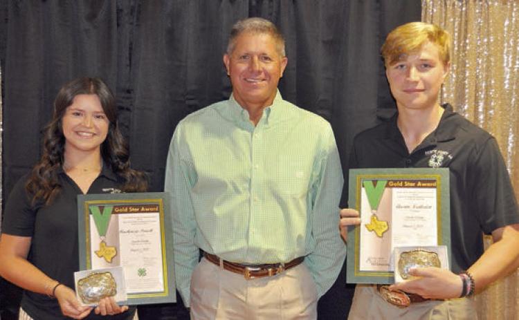 Gold Star AWARD – (from left) Mackenzie Poncik, presenter Commissioner Harvey Berckenhoff and Austin Nedbalek.