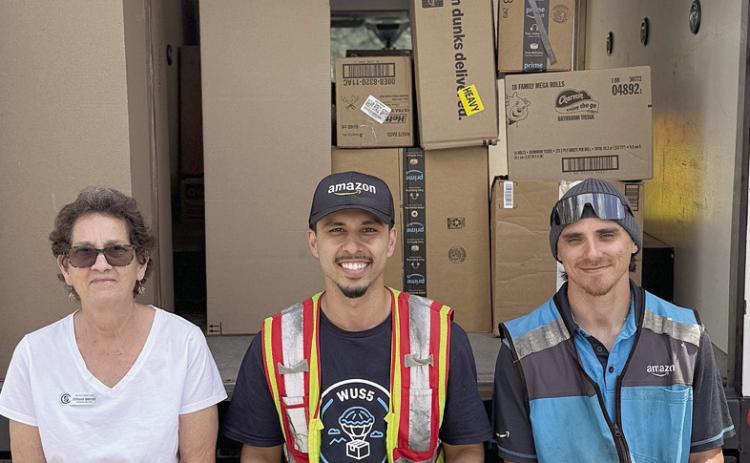 Amazon selected Senior Connections as its “Non-Profit of the Month” to receive donations, and as a result Senior Connections was given a huge amount of items for bingo prizes as well as kitchen supplies. Program director Stephanie Shroyer (left) is shown with Mo and Zack from Amazon out of Kyle.