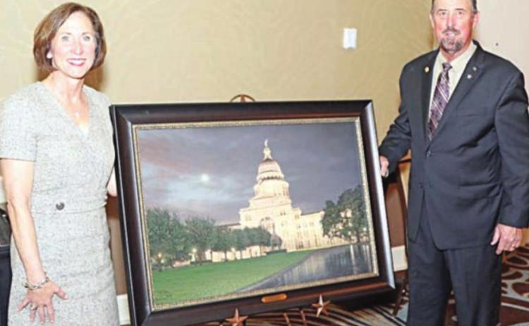 State Sen. Lois Kolkhorst (left) was presented the S.M. True Agricultural Champion Award by Texas Farm Bureau AGFUND president Russell Boening (right).