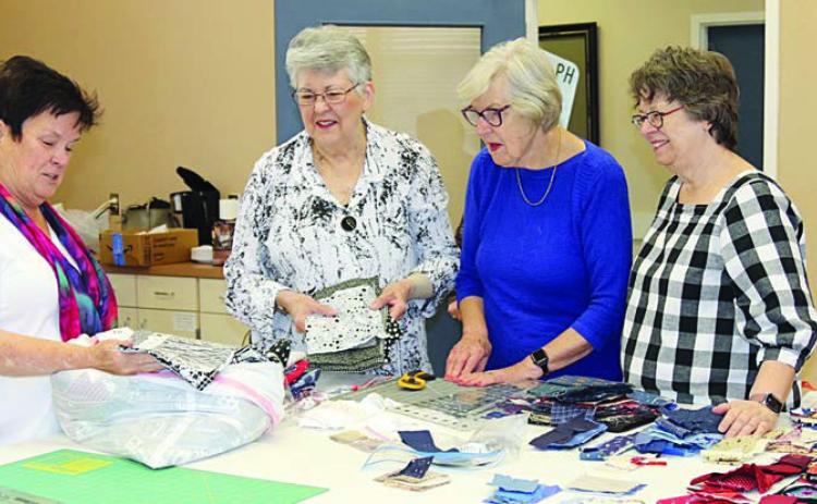 Workshop lead ers were (from left) Debbi Gabler and Joe Anne Hill, shown with Brigette Mesecke (second from right) and Kathi Babcock (right).