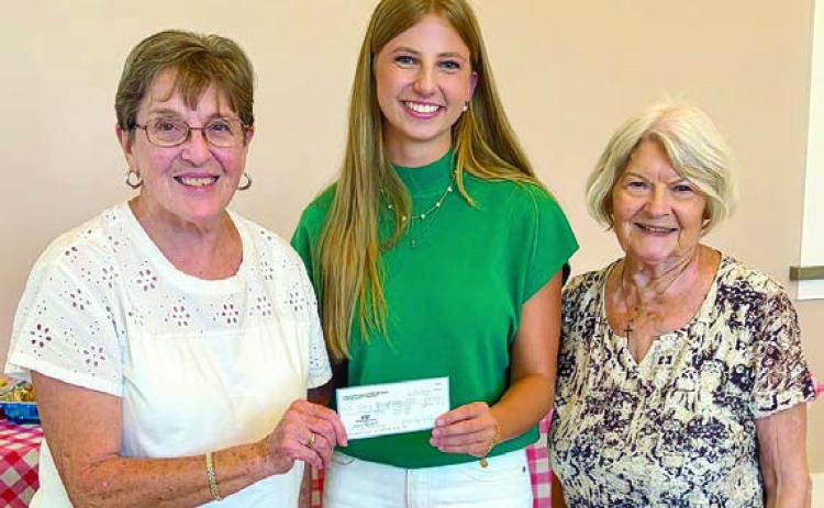 The Amos Pavlik Memorial Sc holarship was presented to Clara Magliolo (center) by Fayette County Czech Heritage Society chapter President Betty Danner (right) and Carolyn Heinsohn (left).