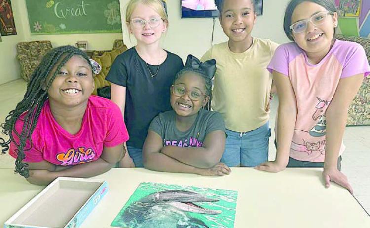 BGC members enjoy putting together puzzles During Power Hour at the Schulenburg Unit of the Boys &amp; Girls Club, members ages 6-18 are provided homework help, tutoring and high-yield learning activities. After Power Hour, the third grade girls enjoyed putting together a few puzzles. Shown are (from left) Ariann Wright, Brynlee Goode, Selby Harvell, Layla Thomas and Jocelyn Alejandres.