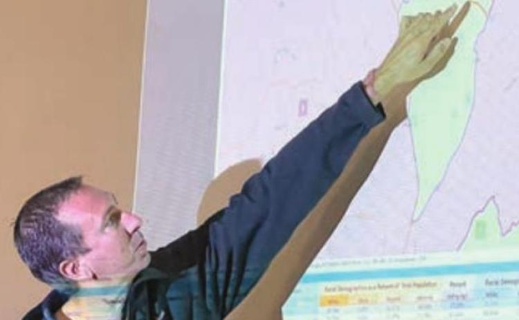Precinct 1 Commissioner Jason McBroom points to the boundary line between Precinct 1 and Precinct 2. Precinct 2 will extend into an area that is currently in Precinct 1 if the redistricting map gets approved on Nov. 10. Photo By Melanie Berger / Courtesy of Flatonia Argus