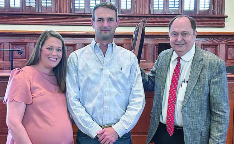 Newly-appointed Place 2 Commissioner Clint Sternadel (center) is shown with his wife, Kristie, and Fayette County Judge Dan Mueller.