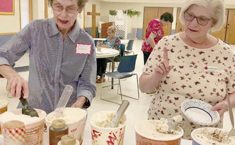 Ic e cream in a variety of flavors, along with toppings, was served at the Fayette County Retired Teachers Association meeting. Among the members enjoying the treat were (from left) Sandra Aschenbeck and Joan Miertschin.