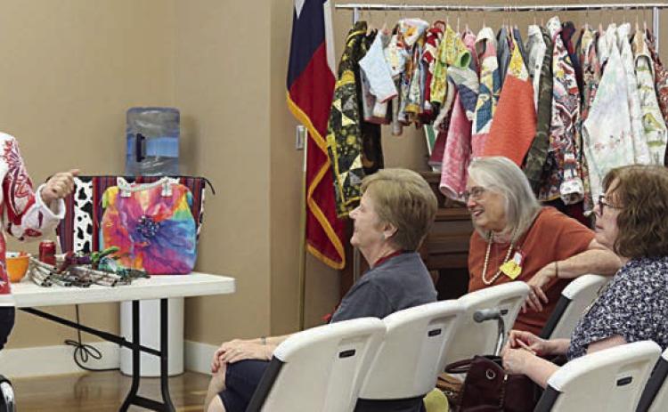 Patricia Roebuck (left) of Lola &amp; Viv Designs spoke at the Colorado Valley Quilt Guild meeting on how to turn old quilts into jackets and bags.