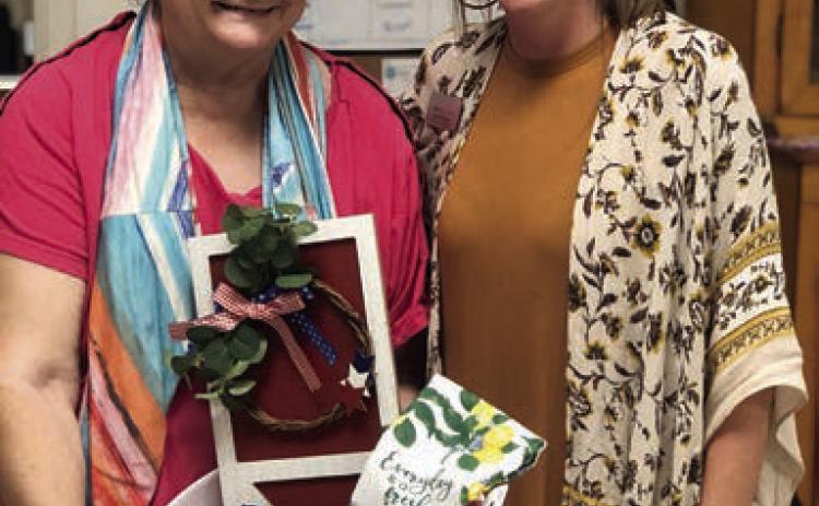 Bingo – Kathy Besetzny (left) made up for lost time and won many bingo games including the blackout prize. Also shown is Chyna Podhajsky (right), bingo caller from Hallettsville Nursing &amp; Rehabilitation Center.