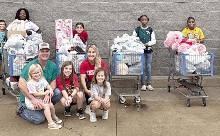 Kainers provide Christmas shopping trip for six Boys & Girls Club members