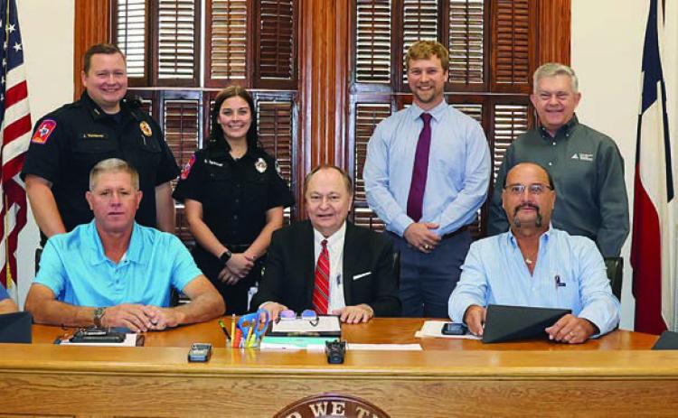 Cost of paramedic school for two EMS employees covered by County, pair of contributions from community partners