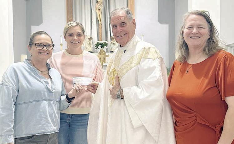 St. Anne’s donates to St. Rose building project