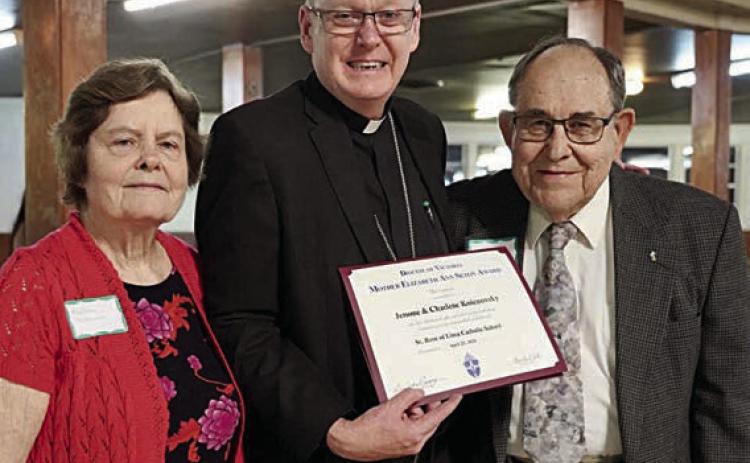 St. Rose of Lima Catholic School selected Charlene Kolenovsky (left) and Jerome Kolenovsky (right) as its recipient of the 2024 St. Mother Elizabeth Ann Seton Award. Making the presentation on April 25 in Shiner was Bishop Brendan Cahill (center) of the Victoria Diocese.