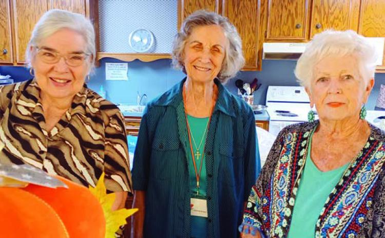 Hostesses at the Garden Club meeting were (from left) Jan Ripper, Wanda Brown and Mary Demel.