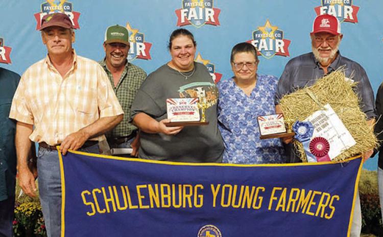 Reserve champion - Shown are (from left) Dennis Brower of BWI, Mark Stang, Matt Arthur of Bumper Crop Texas, Chelsea Moeller, Jennifer Moeller, Ed Moeller and Susan Wick of Schulenburg Young Farmers. Photo By Andy Behlen/Courtesy of Fayette County Record