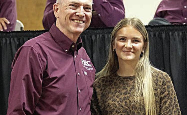 Sophie Vinklarek (right), graduate of Smithville High School, was selected to receive Fayette Electric Cooperative’s “luck of the draw” scholarship. Vinklarek was congratulated by FEC general manager and CEO Doug Lambert (left).