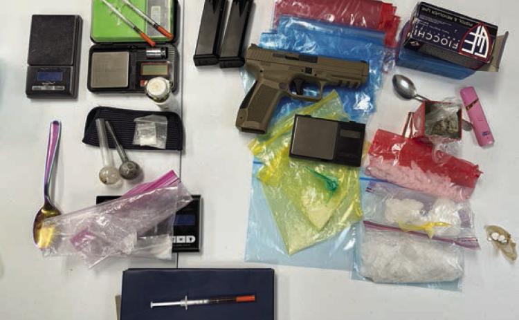 Over 200 grams of methamphetamine and a handgun were confiscated when two search warrants were executed in La Grange.