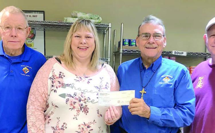 Schulenburg Knights of Columbus Council 2902, represented by Ken Berger (left) and Ed Kusy (third from left) donated $500 to the Schulenburg Area Food Pantry. Accepting the donation are Food Pantry secretary Sheila Brossmann (second from left) and Food Pantry vice president Jack Niesner (right).
