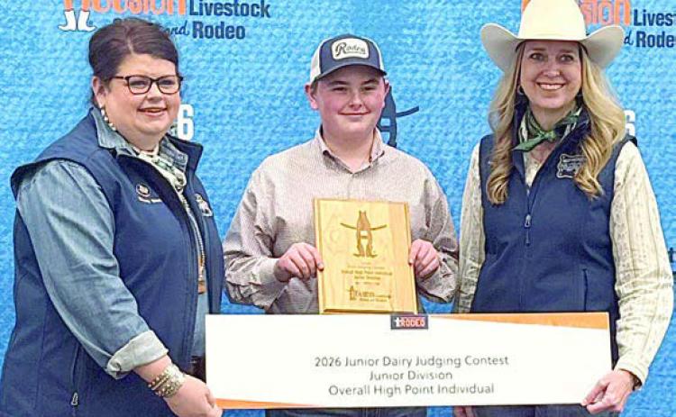 High point junior at the HLSR Dairy Judging Contest was Abraham McBride (center), pictured with two HSLR representatives. The HLSR event also served as the District 11 Dairy Judging Contest, in which McBride was high point intermediate.