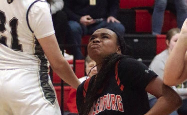 Jashiya Jackson gets by a Lady Panther for a bucket in the fourth quarter. Sticker Photo By Darrell Vyvjala