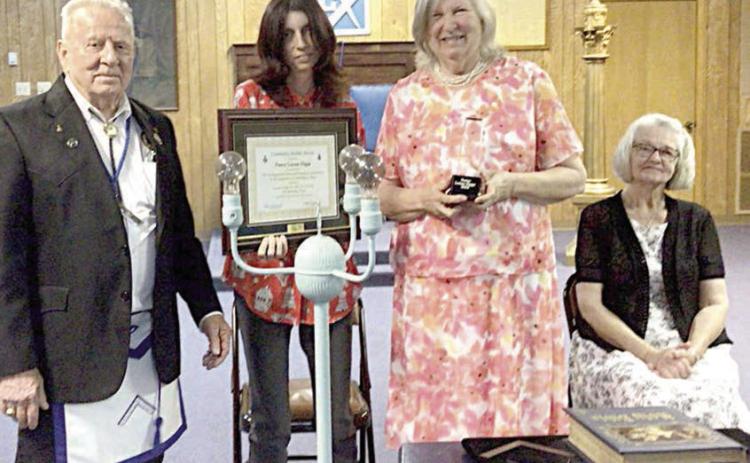 Masons present Community Builder Award to Rev. Higgs