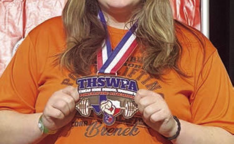 Cora Brenek shows off her state medal.