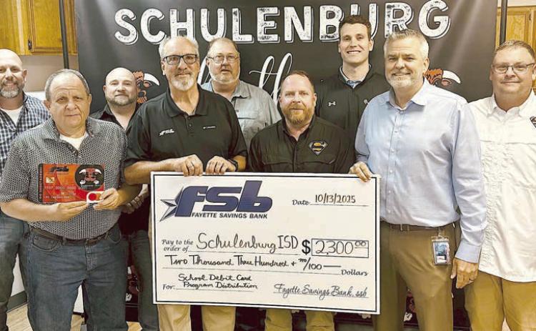 As Fayette Savings Bank presented a check to Schulenburg ISD through its School Spirit Debit Card Program, on hand were (from left) Brad Tumis and Rodney Kalich, FSB; Jarrod Schramek, SISD board; Mike Olle, FSB; Michael Zweschper, Michael Demel and Hale Hentges, SISD board; SISD Supt. Lee Hafley; and Troy Brenek, SISD board.