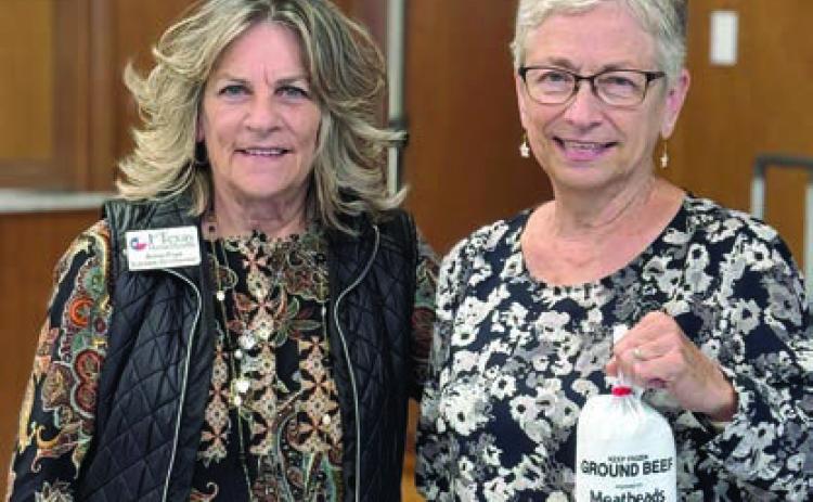 Calling bingo in Weimar at First United Methodist Church on Tuesday, Nov. 19 was Anne Frye (left) of Texas Home Health. Peggy Hiatt (right) was the lucky winner of the blackout prize. She received two pounds of high-quality ground beef from Texas beef.