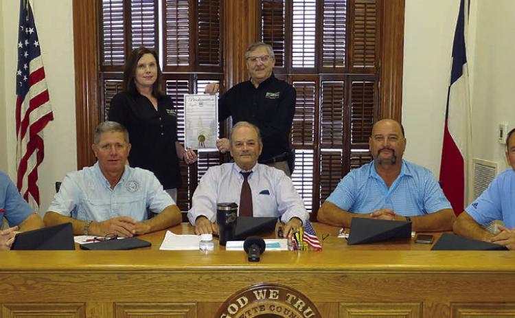 On hand for the proclamation commemorating FEC’s 85th anniversary were: (front, from left) Precinct 4 Commissioner Drew Brossmann, Precinct 3 Commissioner Harvey Berckenhoff, County Judge Joe Weber, Precinct 2 Commissioner Luke Sternadel, Precinct 1 Commissioner Jason McBroom; (back, from left) FEC Marketing and Training Coordinator Tracy Denton, and FEC General Manager Gary Don Nietsche. Photo By Melanie Berger / Courtesy of Flatonia Argus