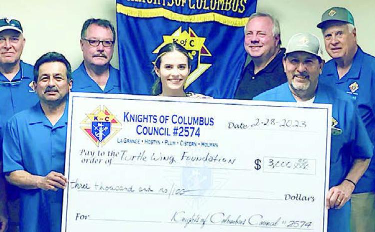 La Grange KCs donate to Turtle Wing La Grange Knights of Columbus Council 2574 presented Turtle Wing Foundation with a generous $3,000 donation recently. In attendance were (from left) KC members Richard Hoffmann, Marcus Recek, Randy Proske, Philip Rocha and Ralph Dunk; Turtle Wing executive director Destiny Psencik; and KC members Charles Youngblood, Hector Cervantez, Pat Lyons, Gary Antosh and Jim Kothmann.