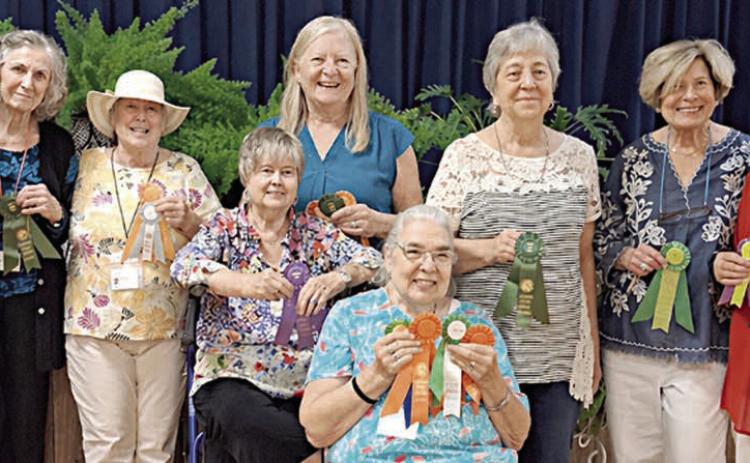 Rosette winners Front: Jan Ripper Back row, from left: Carol Archer Wanda Brown Nancy Tinsley Bonnie Baker Janet Murphy Debbie Behlen Nova Stonecipher and Mary Demel