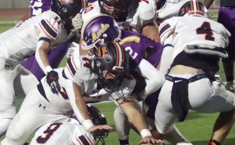 Bringing down Caden Judie for a loss of 3 in the second quarter are Jayse Janda (No. 4), Aidan Mendez (No. 44), Adin Beyer (No. 9), Nick Goode (No. 11, Marshall Wellborn (No. 70), and Preston Kahn (No. 50). Sticker Photo By Layne Vyvjala