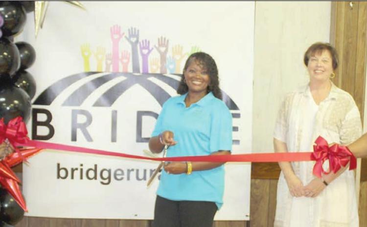On hand for a ribbon cutting at Saturday’s meet-and-greet community social were: (from left) BRIDGE executive directors Rebecca Powe and LaKeisha Brown-Moore, Schulenburg Chamber of Commerce Executive Director Terri Wagner, and BRIDGE Executive Director LaToya Kindred-Ray.