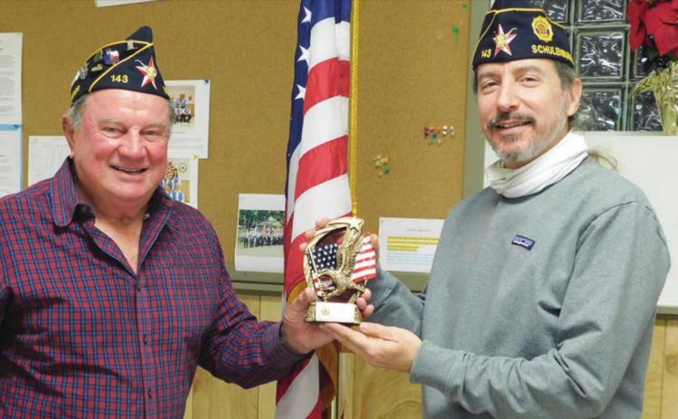 McBride Post 143 Commander Bob Heinrich (left) presents the 2020 “Legionnaire of the Year” award to Ed Semler.