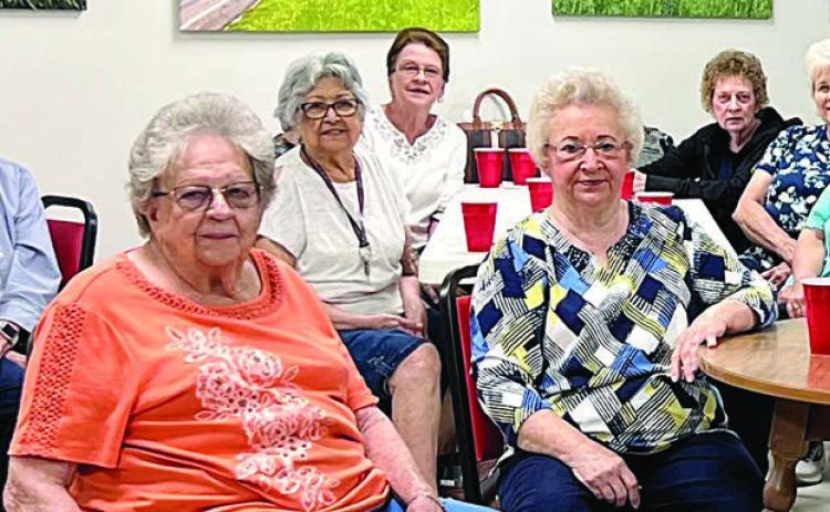 Several members are shown getting ready for lunch at the Senior Connections Center. Lunch is served each Monday and Wednesday, with a chef’s choice light lunch on Friday.