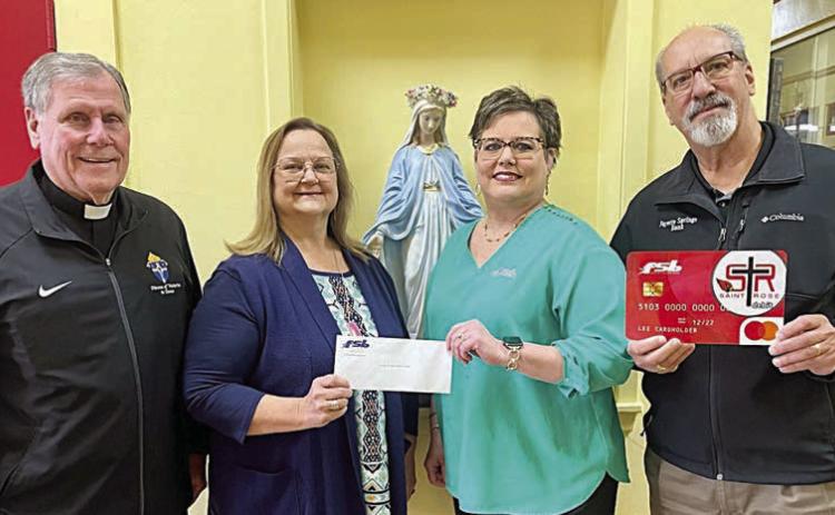 On hand as Fayette Savings Bank presented a check to St. Rose School through its School Spirit Debit Card Program were (from left) Rev. Jasper Liggio, St. Rose of Lima Catholic Church pastor; Rosanne Gallia, St. Rose School principal; and Cheryl Brossmann and Mike Olle, representing Fayette Savings Bank.