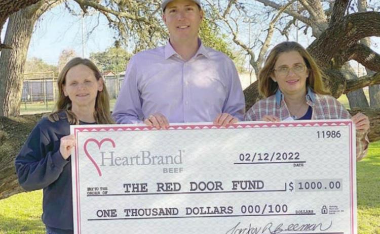 HeartBrand Beef in Flatonia held a special promotion from which a $1,000 donation was made to the Red Door Fund. Shown are (from left) Christine Mulholland, Red Door fund advisor; Jordan Beeman, owner, HeartBrand Beef; and Vicki Hudec, Red Door fund advisor.