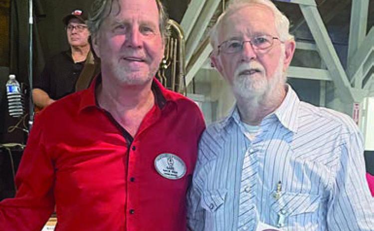 PHOTO ABOVE – $1,000 lifetime membership to the Polka Lovers Club of Texas Museum was won by Wilbert Cernosek (right). He is shown with PLCTM president Gary Bucek (left). PHOTO AT RIGHT – GOODWILL AMBASSADORS for the Polka Lovers Klub of America Louis Stewart and Paula Amsler enjoy a dance.
