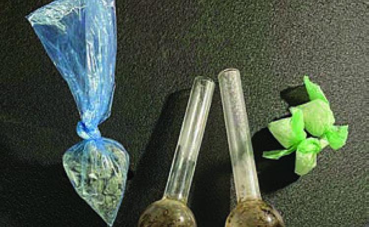 Shown above are the drugs and meth pipes found by SPD officers during a vehicle search Friday morning.