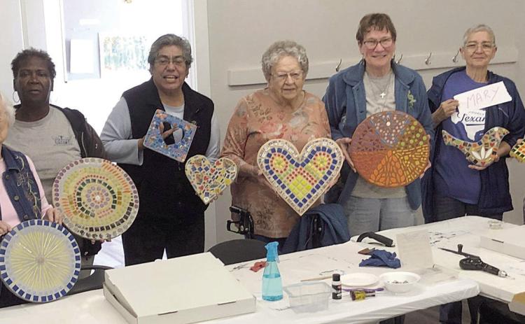 On Mosaic mania photo day, nine members were present to show off the mosaic art they created – (from left) Polly Quinones, Helen McIntyre, Alfreda Ellison, Cindy Villarreal-director, Irene Janda, Berni Gillings, Mary Bellinger, Carolyn Moore and JoNell Vacek.