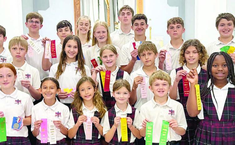 WiNNers from St. Rose of Lima Catholic School in the District 38AA PSIA Academic Meet were (front row, from left) Rowan Heinrich, Emma Zweschper,  Margot Machac, Harper Wright, Benjamin Sustr, Ava Boston, (middle row) Sebastian Lincoln, Brielle Goedrich, Emileigh Divin, Kasen Zbranek, Lane Schiffli,  (back row) Luke Goedrich, Levi Johnson, Micah Garcia, Cate Hooper, Briley Hartensteiner, Kaleb Zapalac, Cal Schiffli, Jack Schiffli and Noah Heger.