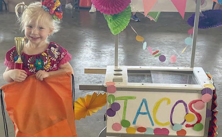 “Abby’s Taco Court” – Abby Smrkovsky.  Sticker Photo By Darrell Vyvjala