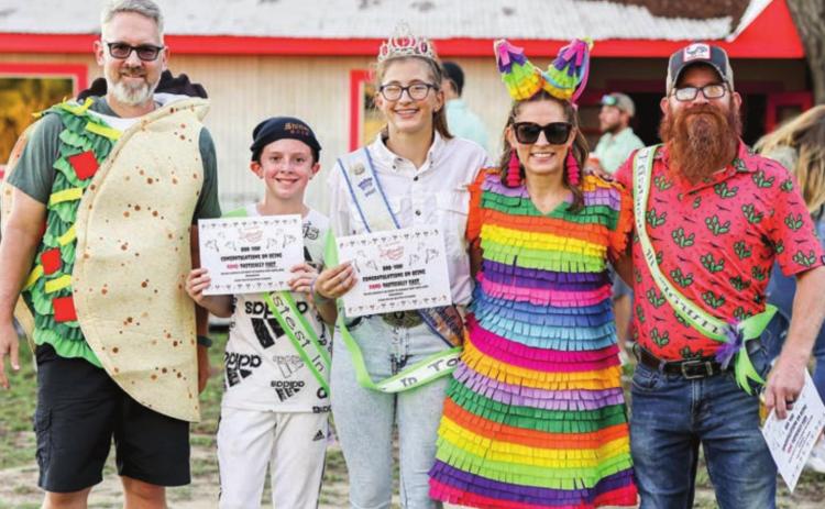 DASH WINNERS – (from left) Chris Hooper, representing Turtle Wing; Charlie Shank, junior high winner, C.J. Prihoda, adult female winner; DeeAnn Hooper, representing Turtle Wing; Rooster Hoffman, adult male winner; (not shown) Kenny Houston, pre-K/K winner; and Braxton Howlett, elementary winner.