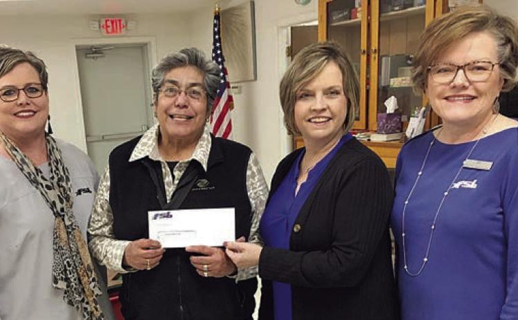 Presenting a $500 do nat ion from Fayette Savings Bank for programs at Senior Connections are Cheryl Brossmann (left), FSB-Schulenburg, , Jennifer Moring (second from right), FSB-Weimar and Jyl Stavinoha (right), FSB Flatonia. Accepting the check is Cindy Villarreal (second from left), Senior Connections executive director.
