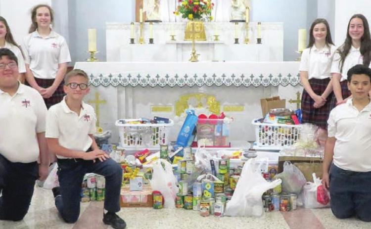 St. Rose donates to Food Pantry, Family Crisis Center at Thanksgiving Mass
