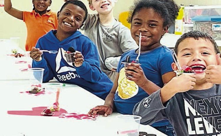 At the Schulenburg Unit of the Boys &amp; Girls Club, Ms. Taliyah Wright facilitated a Valentine’s Day celebration by creating “dirt cups” with her members. Shown are (from left) Club members Jakhaylin Caine, Braxton Spradley, Dredyn Wright, Legacy Crenshaw and Valdemar Pineda.