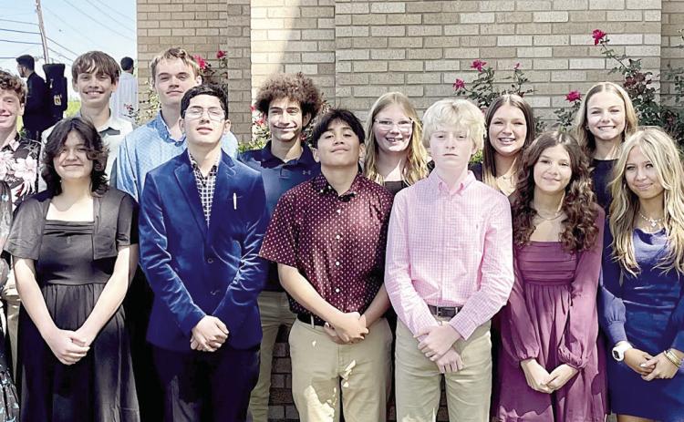 Attending the Chrism Mass in Victoria on March 26 were: Front row, from left: Rev Jasper Liggio-St. Rose pastor, Valerie Sedlar, Destani Brown, Christopher Campos, Maximo Hernandez, Allen Ballard, Anna Oeding and Layney Conner. Back row, from left: William Taylor, Charlie Shank, Adam Schramek, Brock Seger, Denver Carr, Ashtyn Schaefer, Brenley Bujnoch, Layne Besetzny, Miranda Bonner and Rev. Luke Prihoda.