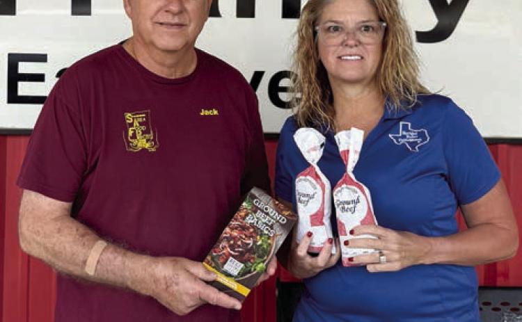 Presentation to Schulenburg Area Food Pantry – (from left) Jack Niesner, SAFP vice president, and Tanya Schindler, NVCW past president.