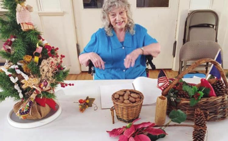 MEDA WOGAN spoke to the Garden Club on including native Texas plants in Christmas decorations.