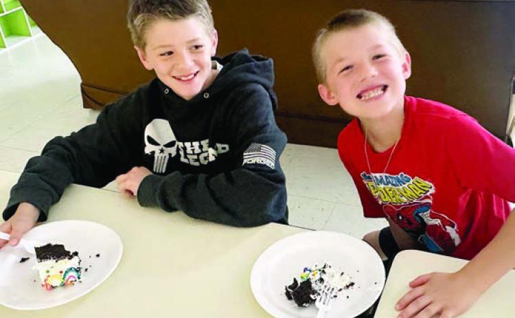 Each month, a generous board member of the Boys &amp; Girls Clubs of Champion Valley donates a cake to honor Club members with birthdays in that month. Shown enjoying a sweet treat are (from left) Camden Spradley and Braxton Spradley.